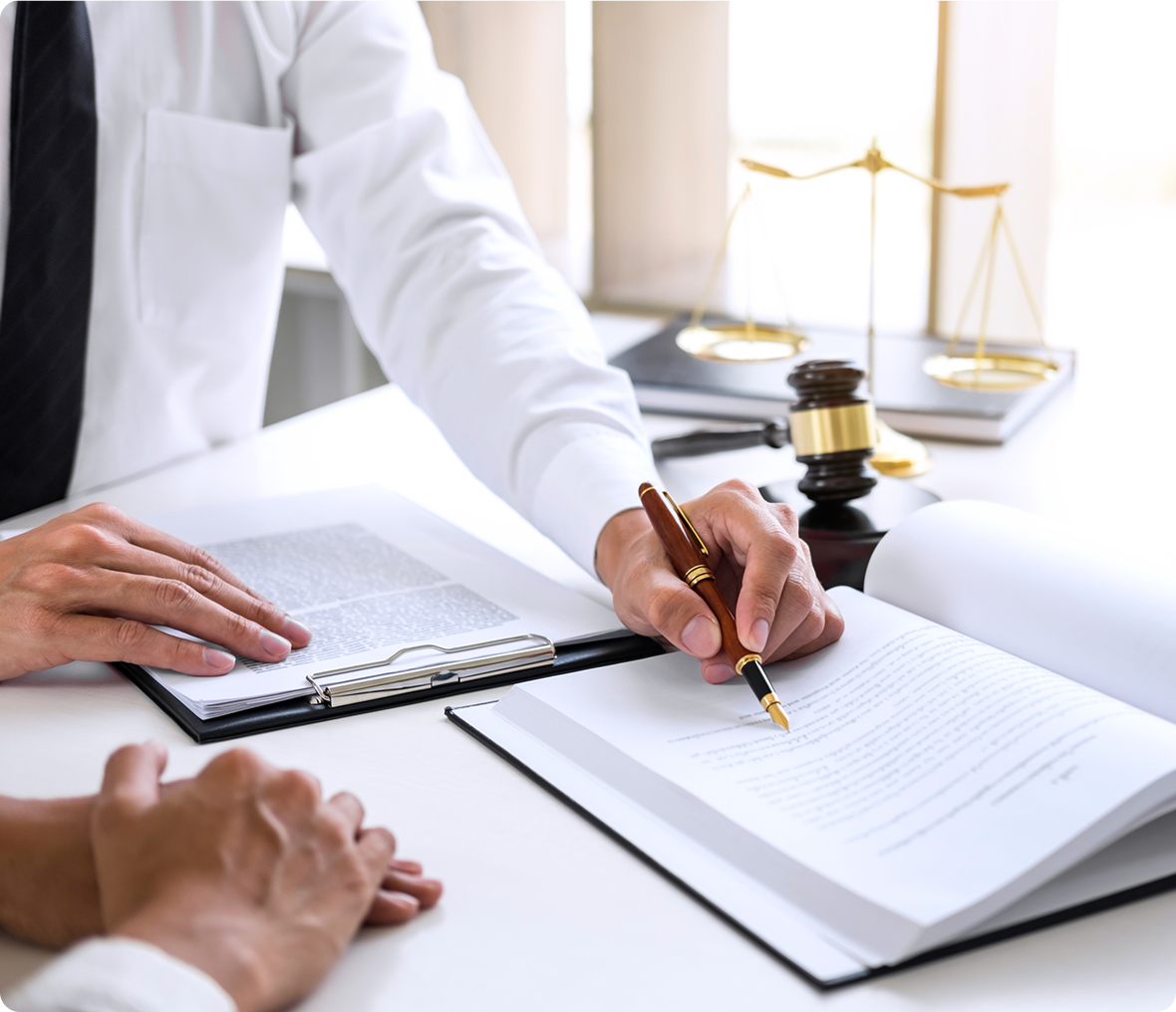 Lawyer reviewing documents with a client.