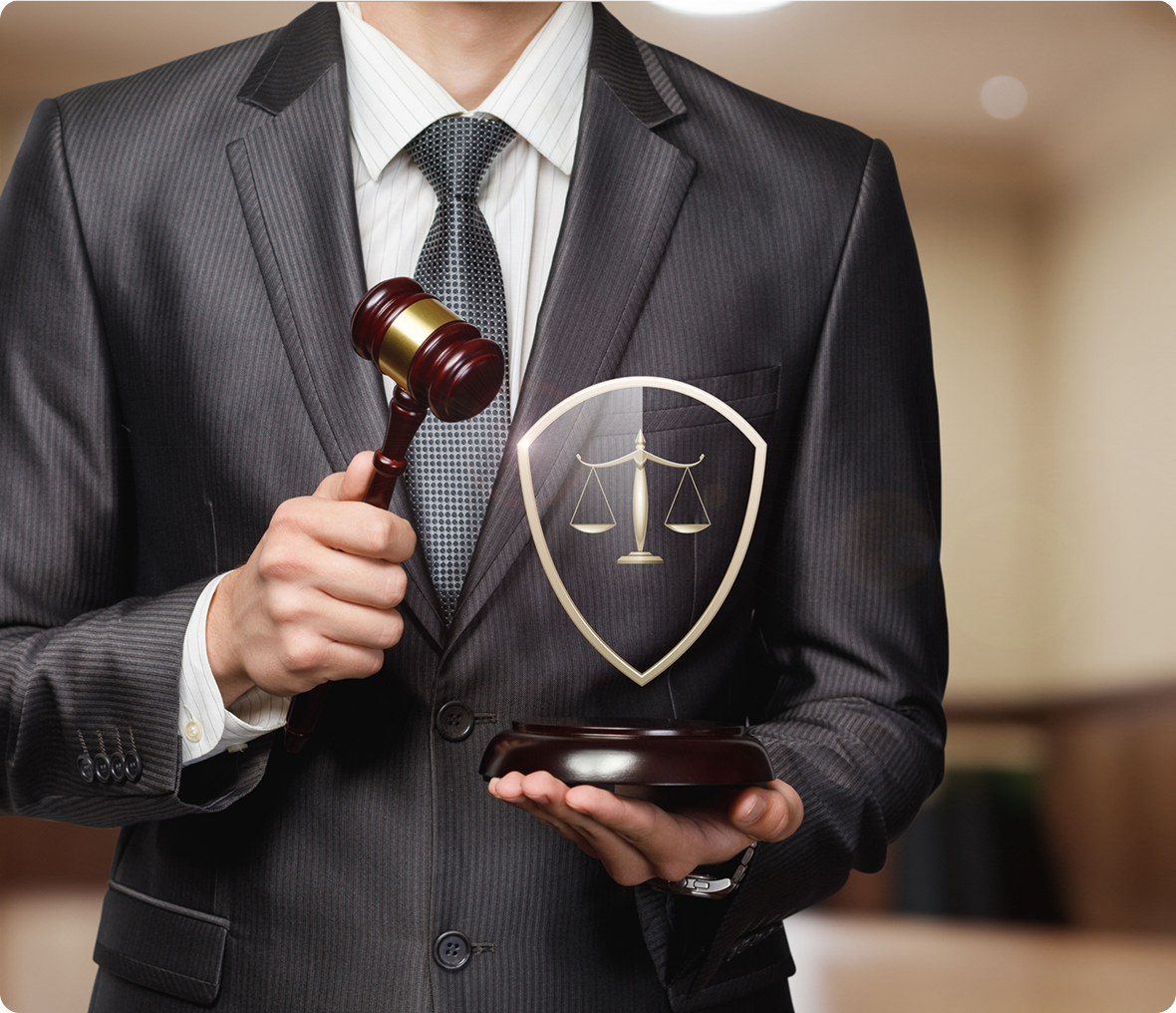 Man holding gavel and justice shield.